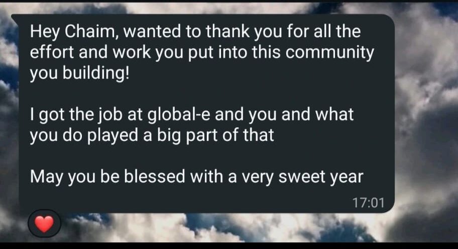 WhatsApp message thanking Chaim - the member got the job at Global-e and the community played a big part
